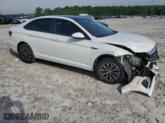 2019 Volkswagen Jetta SEL with VIN 3VWE57BU9KM047413, listed as a Copart auction lot 57221625 with 127,556 mi miles and Salvage title. Bid and sale history available at DreamBid. Image 4.