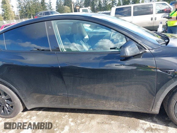2022 Tesla Model Y Long Range with VIN 7SAYGDEEXNF459834, listed as a IAAI auction lot 42004576 with 56,175 mi miles and . Bid and sale history available at carsss.com. Image 13.