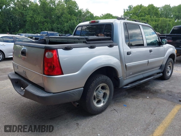 2005 Ford Explorer Sport Trac XLS z VIN 1FMZU77K75UB52008, wystawiony jako IAAI lot #42103222 z przebiegiem 196 605 mil mil oraz . Historia ofert i sprzedaży dostępna na DreamBid. Obrazek 4.