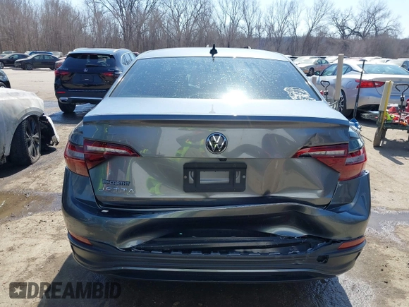 2022 Volkswagen Jetta Sport with VIN 3VWBM7BU6NM017084, listed as a IAAI auction lot 41784555 with 60,364 mi miles and . Bid and sale history available at DreamBid. Image 6.
