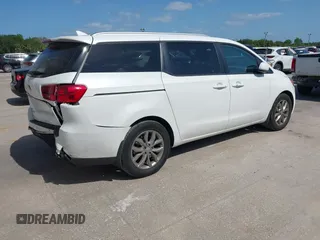 2021 Kia Sedona LX with VIN KNDMB5C12M6661917, listed as a IAAI auction lot 42129682 with 80,321 mi miles and . Bid and sale history available at carsss.com. Image 4.