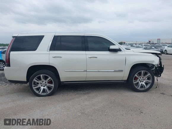 2015 Cadillac Escalade Premium z VIN 1GYS4CKJ4FR216873, wystawiony jako IAAI lot #41677234 z przebiegiem 128 990 mil mil oraz . Historia ofert i sprzedaży dostępna na DreamBid. Obrazek 13.