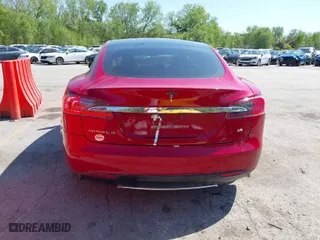 2014 Tesla Model S 60 kWh Battery with VIN 5YJSA1H1XEFP38289, listed as a IAAI auction lot 42092052 with 75,668 mi miles. Bid and sale history available at carsss.com. Image 17.
