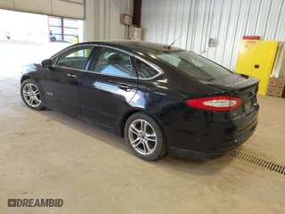 2016 Ford Fusion Titanium Hybrid with VIN 3FA6P0RU7GR127307, listed as a IAAI auction lot 41944427 with 128,076 mi miles. Bid and sale history available at carsss.com. Image 3.