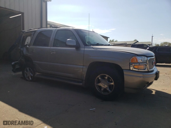 2002 GMC Yukon Denali with VIN 1GKEK63U72J274220, listed as a Copart auction lot 71891634 with 140,885 mi miles and Salvage Title. Bid and sale history available at carsss.com. Image 4.
