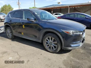 2021 Mazda CX-5 Grand Touring with VIN JM3KFBDM3M1344784, listed as a Copart auction lot 58051445 with 69,593 mi miles and Salvage title. Bid and sale history available at DreamBid. Image 4.
