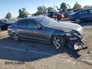 2011 Mercedes-Benz E 550 Luxury with VIN WDDHF7CBXBA307881, listed as a Copart auction lot 84961394 with 192,563 mi miles and Salvage Title. Bid and sale history available at DreamBid. Image 4.