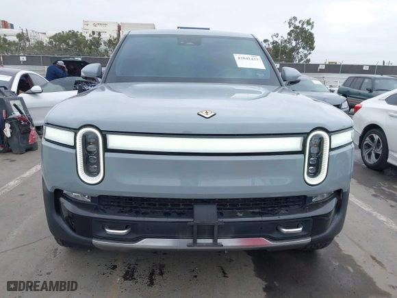 2023 Rivian R1T Launch Edition with VIN 7FCTGAAL3PN017339, listed as a IAAI auction lot 42041423 with 15,098 mi miles. Bid and sale history available at carsss.com. Image 13.