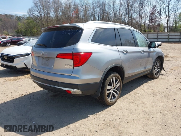 2017 Honda Pilot Touring with VIN 5FNYF6H98HB100335, listed as a IAAI auction lot 41907709 with 1 mi miles. Bid and sale history available at carsss.com. Image 4.