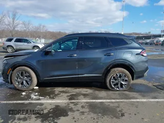 2023 Kia Sportage SX-Prestige with VIN KNDPXCAG5P7038476, listed as a IAAI auction lot 41532005 with 14,151 mi miles and . Bid and sale history available at DreamBid. Image 14.