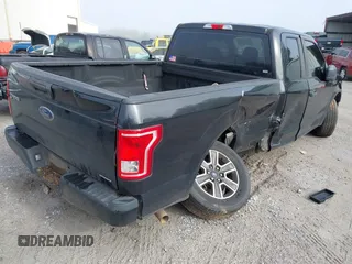 2015 Ford F-150 XL with VIN 1FTEX1CF2FKD12874, listed as a IAAI auction lot 41860610 with 242,215 mi miles. Bid and sale history available at carsss.com. Image 4.