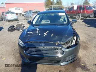 2015 Ford Fusion S Hybrid with VIN 3FA6P0UU7FR117785, listed as a IAAI auction lot 41589546 with 136,657 mi miles. Bid and sale history available at carsss.com. Image 12.