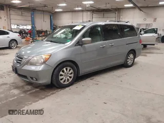 2009 Honda Odyssey EX-L with VIN 5FNRL38789B015524, listed as a IAAI auction lot 42135465 with 242,005 mi miles. Bid and sale history available at carsss.com. Image 2.