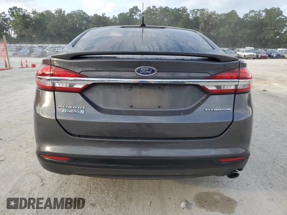 2017 Ford Fusion Titanium z VIN 3FA6P0SU0HR290201, wystawiony jako Copart lot #60106095 z przebiegiem 98 086 mil mil oraz Szkoda całkowita • Salvage title. Historia ofert i sprzedaży dostępna na DreamBid. Obrazek 6.