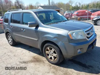 2011 Honda Pilot Touring with VIN 5FNYF4H94BB035415, listed as a IAAI auction lot 42126738 with 239,273 mi miles. Bid and sale history available at carsss.com. Image 1.