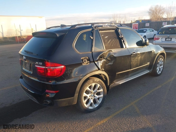 2011 BMW X5 35i with VIN 5UXZV4C54BL402935, listed as a IAAI auction lot 41198827 with 120,157 mi miles. Bid and sale history available at carsss.com. Image 4.