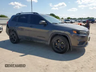 2019 Jeep Cherokee Altitude with VIN 1C4PJLLB8KD448427, listed as a Copart auction lot 58101445 with 173,007 mi miles and Salvage title. Bid and sale history available at DreamBid. Image 4.