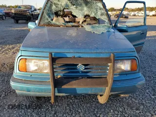 1992 Suzuki Sidekick z VIN 2S3TC01C2N6405497, wystawiony jako Copart lot #75856164 z przebiegiem 38 423 mil mil oraz Szkody całkowita. Historia ofert i sprzedaży dostępna na DreamBid. Obrazek 11.