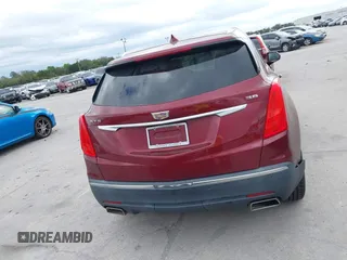 2017 Cadillac XT5 FWD with VIN 1GYKNARS2HZ107587, listed as a IAAI auction lot 41614842 with 124,611 mi miles and . Bid and sale history available at carsss.com. Image 16.