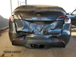 2021 Tesla Model Y Long Range with VIN 5YJYGDEEXMF151557, listed as a Copart auction lot 54936885 with 106,411 mi miles and Salvage Title. Bid and sale history available at DreamBid. Image 6.