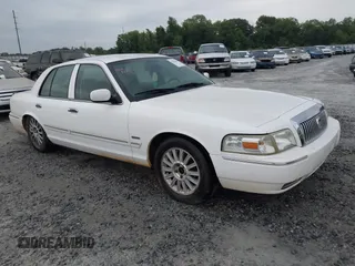 2010 Mercury Grand Marquis LS z VIN 2MEBM7FV5AX606873, wystawiony jako IAAI lot #42216310 z przebiegiem 198 896 mil mil oraz . Historia ofert i sprzedaży dostępna na DreamBid. Obrazek 1.