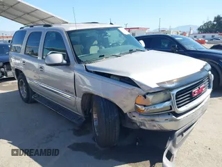 2005 GMC Yukon SLT z VIN 1GKEC13VX5J182841, wystawiony jako IAAI lot #42010227 z przebiegiem 218 909 mil mil oraz . Historia ofert i sprzedaży dostępna na DreamBid. Obrazek 1.