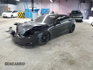 2022 Tesla Model S Plaid with VIN 5YJSA1E65NF487665, listed as a Copart auction lot 55261025 with Not provided miles and Salvage title. Bid and sale history available at DreamBid. Image 1.