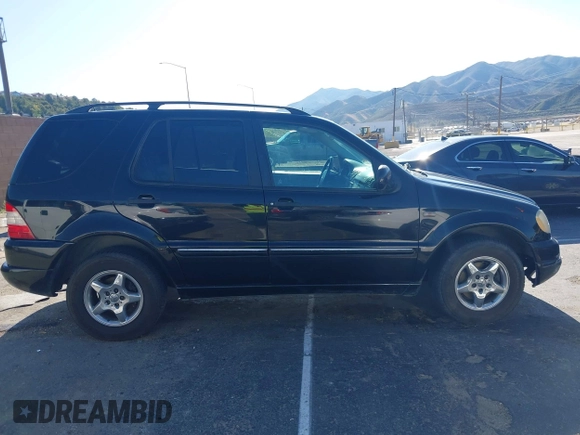 2001 Mercedes-Benz M-Class with VIN 4JGAB54E01A272539, listed as a IAAI auction lot 42124321 with 272,098 mi miles. Bid and sale history available at carsss.com. Image 13.
