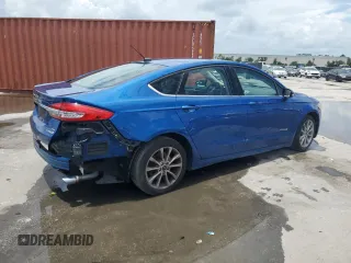 2017 Ford Fusion Hybrid SE z VIN 3FA6P0LU6HR319103, wystawiony jako Copart lot #58494695 z przebiegiem 104 483 mil mil oraz Szkoda całkowita • Salvage title. Historia ofert i sprzedaży dostępna na DreamBid. Obrazek 3.