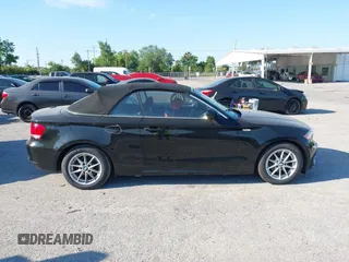 2011 BMW 1 Series 128i with VIN WBAUL7C55BVM81049, listed as a IAAI auction lot 41892811 with 50,659 mi miles and . Bid and sale history available at carsss.com. Image 14.