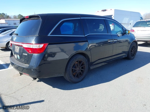 2013 Honda Odyssey Touring with VIN 5FNRL5H99DB076385, listed as a IAAI auction lot 41751504 with 233,875 mi miles. Bid and sale history available at carsss.com. Image 4.