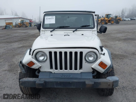 2006 Jeep Wrangler Sport Right Hand Drive with VIN 1J4F449S16P709895, listed as a IAAI auction lot 41349311 with 157,125 mi miles. Bid and sale history available at carsss.com. Image 12.