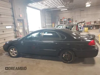 2004 Ford Taurus SE z VIN 1FAFP53U74G107504, wystawiony jako IAAI lot #42068692 z przebiegiem Nie podano mil oraz . Historia ofert i sprzedaży dostępna na DreamBid. Obrazek 14.
