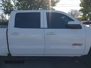 2017 Chevrolet Silverado 1500 LT with VIN 3GCUKREC4HG466329, listed as a IAAI auction lot 41305052 with 57,844 mi miles and . Bid and sale history available at DreamBid. Image 12.