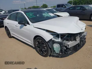 2022 Kia K5 GT-Line z VIN 5XXG64J27NG122462, wystawiony jako IAAI lot #41936636 z przebiegiem 30 624 mil mil oraz . Historia ofert i sprzedaży dostępna na DreamBid. Obrazek 1.