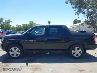 2011 Honda Ridgeline RTL with VIN 5FPYK1F50BB001442, listed as a IAAI auction lot 42023615 with 189,170 mi miles. Bid and sale history available at carsss.com. Image 14.
