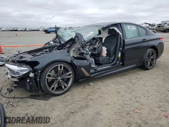 2019 BMW 5 Series M550i xDrive with VIN WBAJB9C53KB464298, listed as a Copart auction lot 59892105 with Not provided miles and Salvage title. Bid and sale history available at DreamBid. Image 1.
