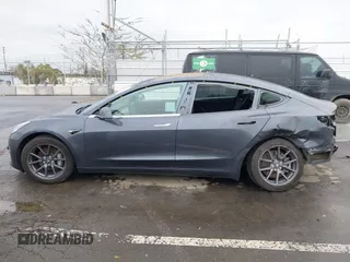 2018 Tesla Model 3 Long Range Battery with VIN 5YJ3E1EB7JF114305, listed as a IAAI auction lot 41765994 with 76,945 mi miles and . Bid and sale history available at DreamBid. Image 15.