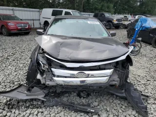 2012 Ford Fusion SE with VIN 3FAHP0HA0CR355529, listed as a Copart auction lot 62585515 with 113,094 mi miles and Salvage title. Bid and sale history available at DreamBid. Image 5.