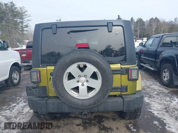 2007 Jeep Wrangler Unlimited Sahara z VIN 1J4GA59137L147257, wystawiony jako IAAI lot #41565673 z przebiegiem 187 982 mil mil oraz . Historia ofert i sprzedaży dostępna na DreamBid. Obrazek 16.