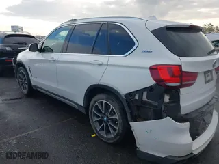 2018 BMW X5 xDrive40e iPerformance with VIN 5UXKT0C58J0V99415, listed as a IAAI auction lot 41391474 with 124,671 mi miles. Bid and sale history available at carsss.com. Image 15.