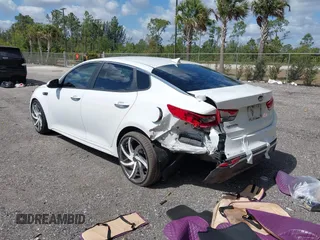 2018 Kia Optima LX z VIN 5XXGT4L39JG272694, wystawiony jako IAAI lot #42155363 z przebiegiem 115 417 mil mil oraz . Historia ofert i sprzedaży dostępna na DreamBid. Obrazek 3.