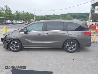 2018 Honda Odyssey Touring with VIN 5FNRL6H89JB057148, listed as a IAAI auction lot 42511909 with 166,438 mi miles and . Bid and sale history available at DreamBid. Image 14.
