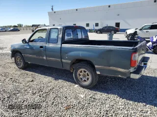 1995 Toyota T100 DX z VIN JT4VD12E0S0005758, wystawiony jako Copart lot #74018364 z przebiegiem 394 656 mil mil oraz Szkody całkowita. Historia ofert i sprzedaży dostępna na DreamBid. Obrazek 2.