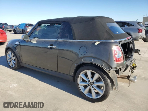 2014 MINI Convertible S with VIN WMWZP3C58ET706941, listed as a Copart auction lot 81900674 with 61,292 mi miles and Salvage title. Bid and sale history available at DreamBid. Image 2.