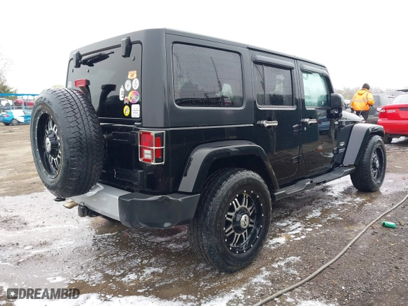 2011 Jeep Wrangler Unlimited Sahara with VIN 1J4BA5H12BL548870, listed as a IAAI auction lot 42010303 with 139,693 mi miles. Bid and sale history available at carsss.com. Image 4.