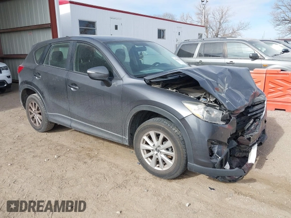 2016 Mazda CX-5 Sport with VIN JM3KE4BY0G0623365, listed as a IAAI auction lot 41525002 with 127,674 mi miles and . Bid and sale history available at carsss.com. Image 1.