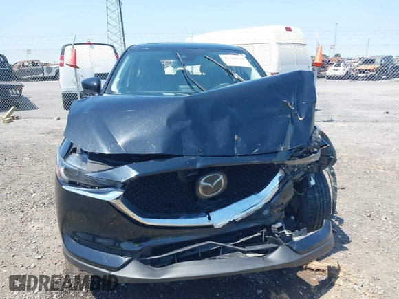 2020 Mazda CX-5 Grand Touring with VIN JM3KFADM9L1837183, listed as a IAAI auction lot 42340628 with 81,975 mi miles and . Bid and sale history available at DreamBid. Image 12.