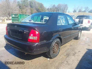 2000 Mazda Protege DX with VIN JM1BJ2227Y0303448, listed as a IAAI auction lot 41482747 with 206,542 mi miles and . Bid and sale history available at DreamBid. Image 4.