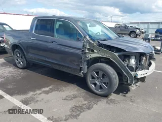 2020 Honda Ridgeline RTL-E z VIN 5FPYK3F71LB004106, wystawiony jako IAAI lot #41950182 z przebiegiem 95 793 mil mil oraz . Historia ofert i sprzedaży dostępna na DreamBid. Obrazek 1.